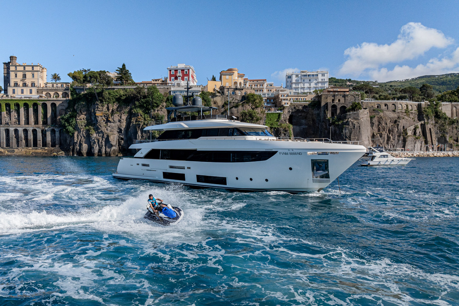 Aerial view of a yacht with water toys and a jetski in the Mediterranean, near Saint-Tropez.