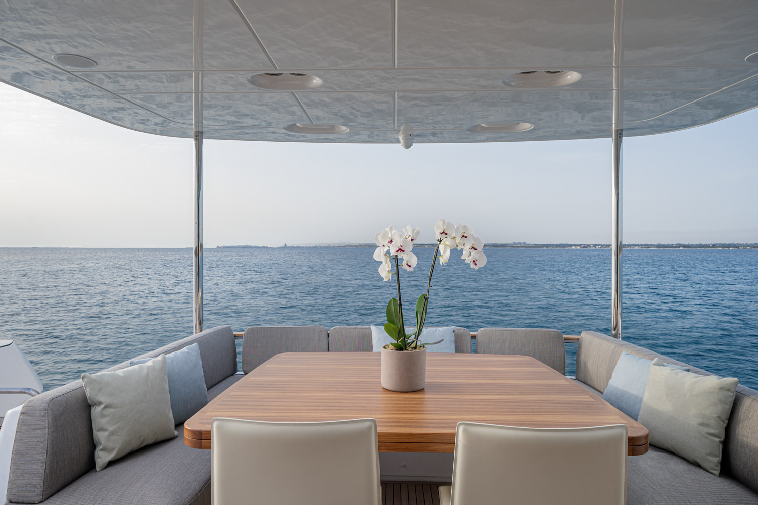 Luxury yacht deck with dining setup captured by a yacht photographer in Monaco