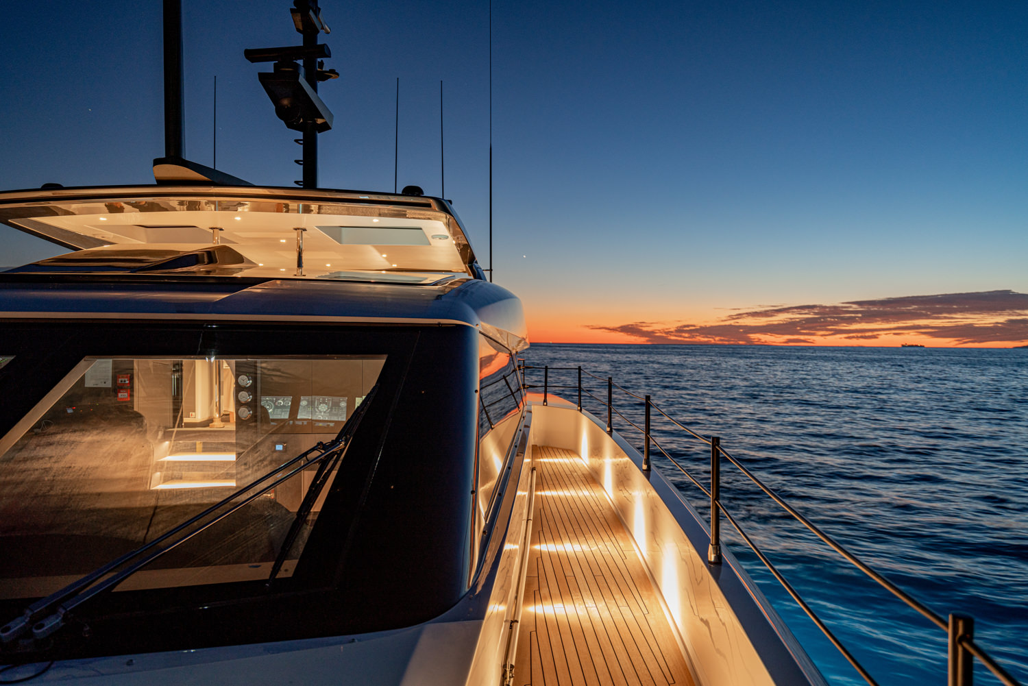 Stunning exterior of a luxury yacht with open deck and serene ocean views, captured during a yacht photoshoot in Monaco
