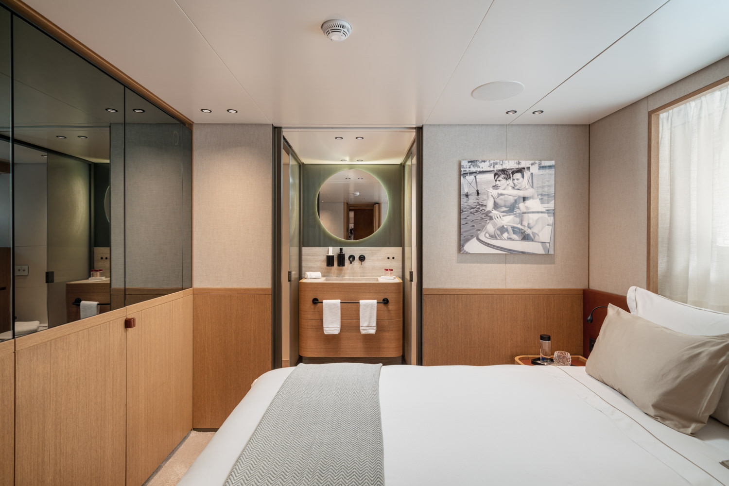 Luxury yacht guest bedroom with elegant decor, photographed in Monaco.