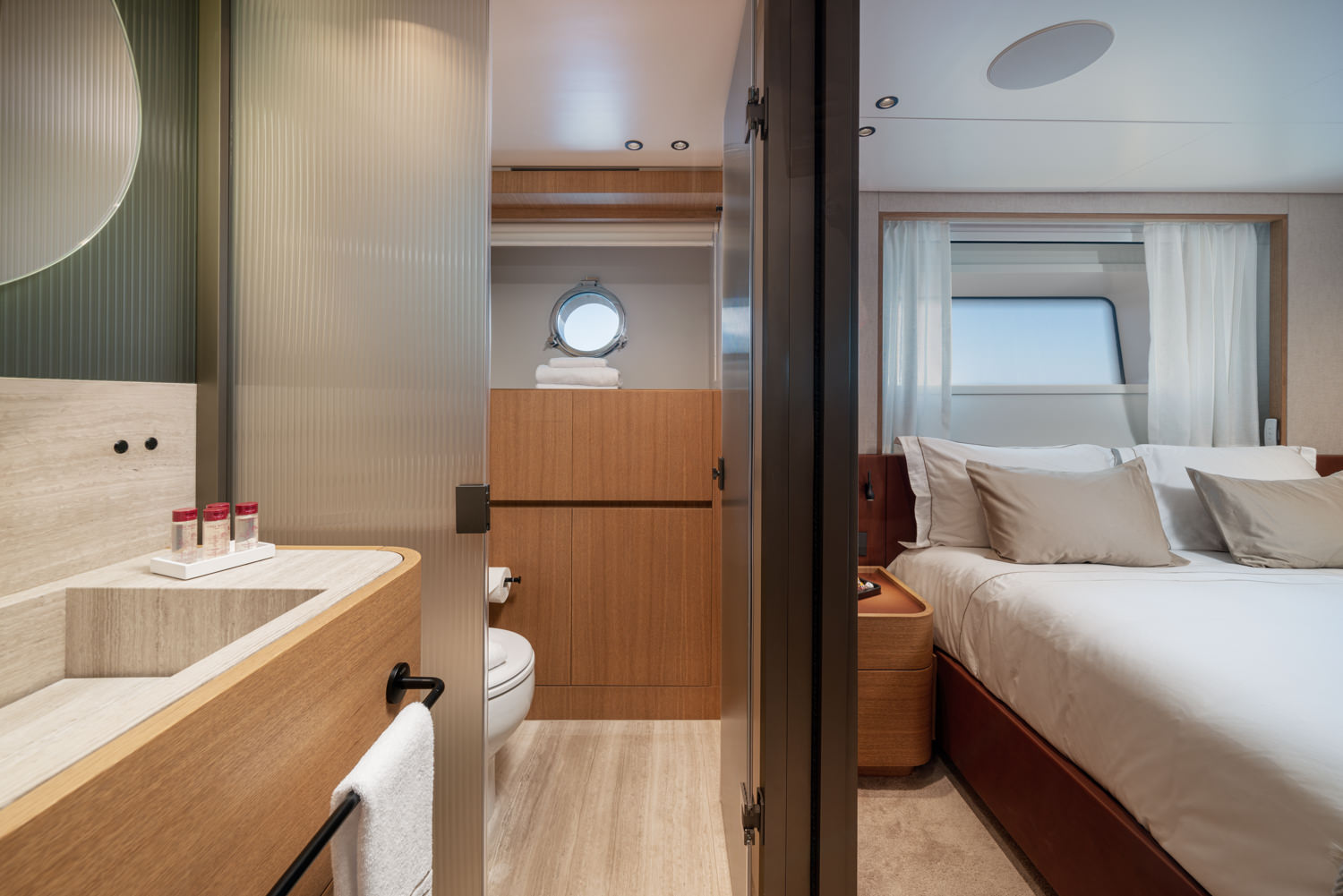 Luxury VIP yacht bedroom with en-suite bathroom, photographed in Antibes.