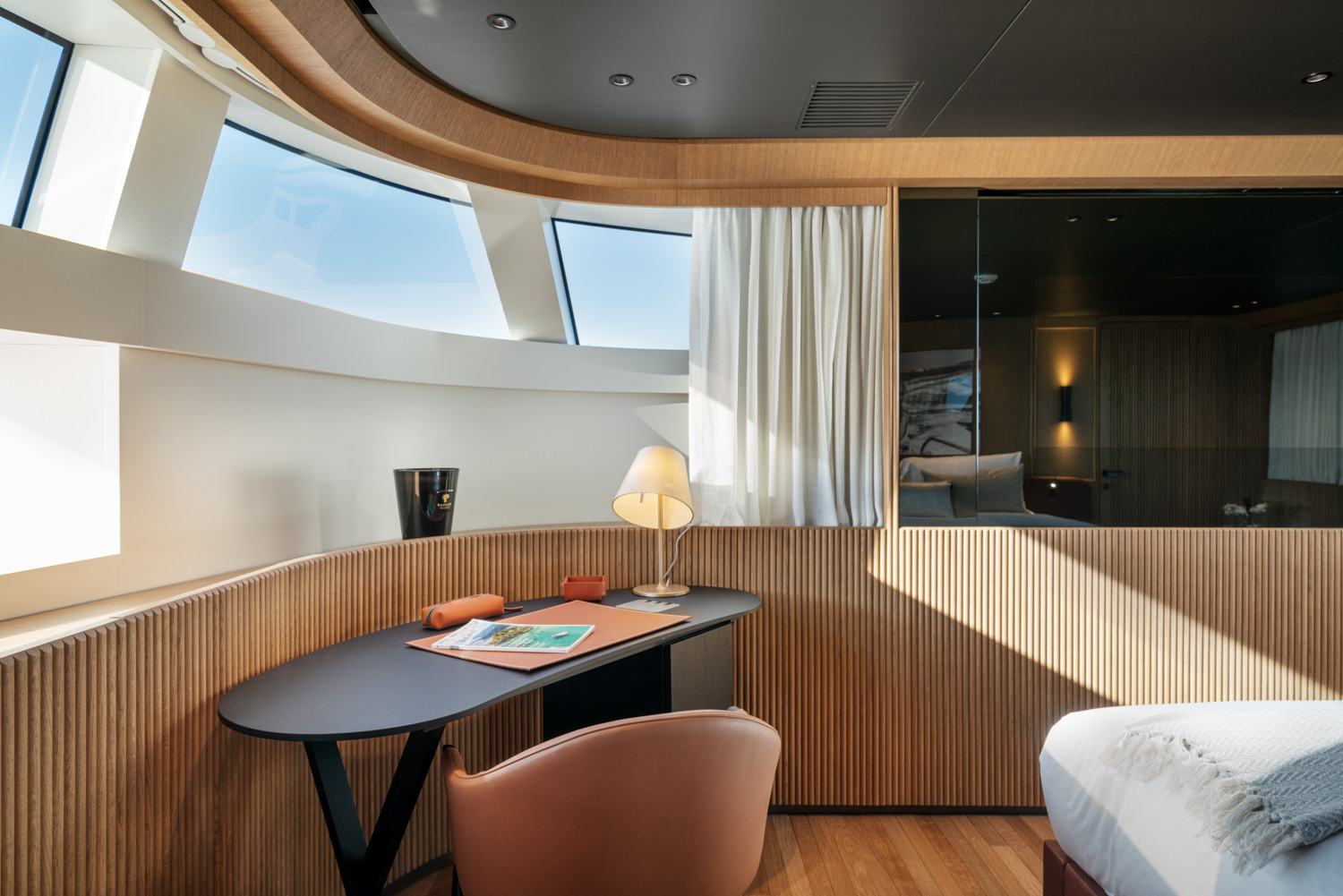 Elegant table in the master room of a luxury yacht, photographed in Monaco.