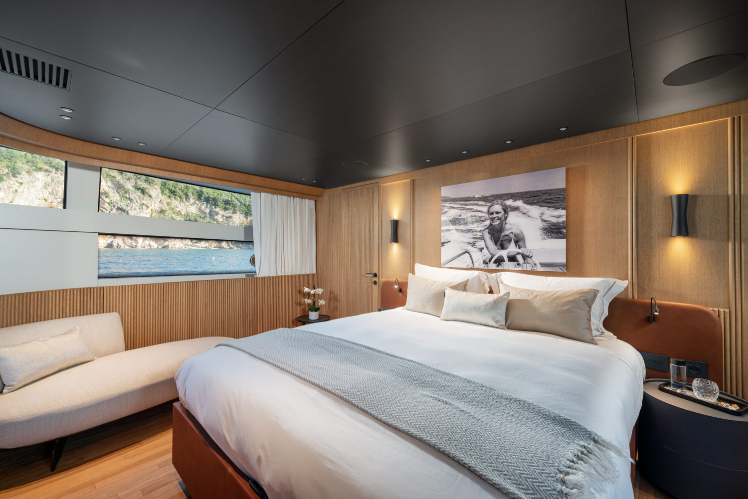 Luxury master bedroom aboard a yacht with refined design, photographed in Naples.