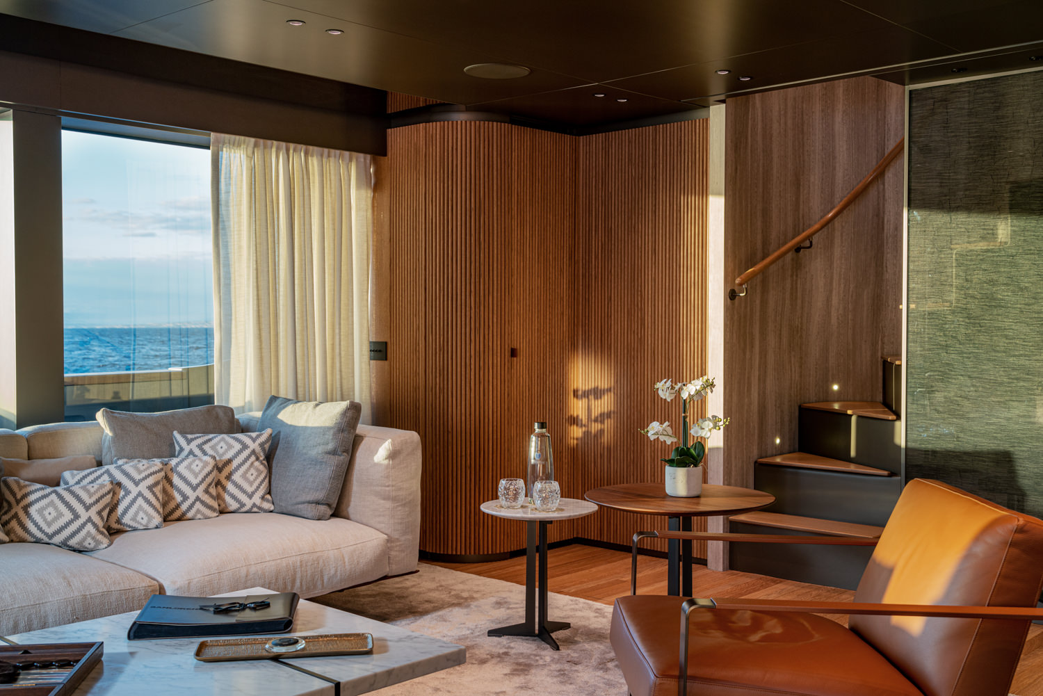Main salon of a Sanlorenzo yacht with modern elegance, photographed in Portofino.