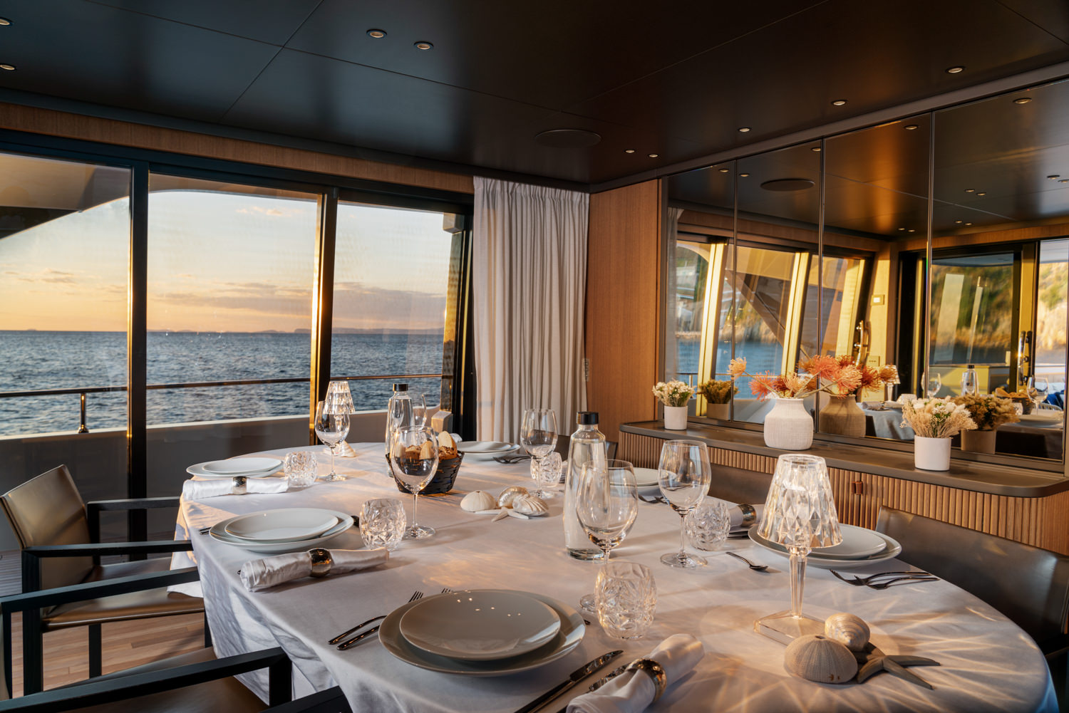 Luxury yacht interior with spacious dining area, photographed in La Spezia.