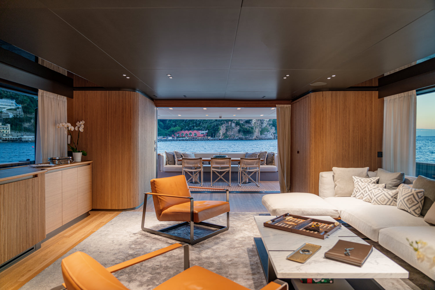 Main salon of a Sanlorenzo yacht with modern elegance, photographed in Monaco