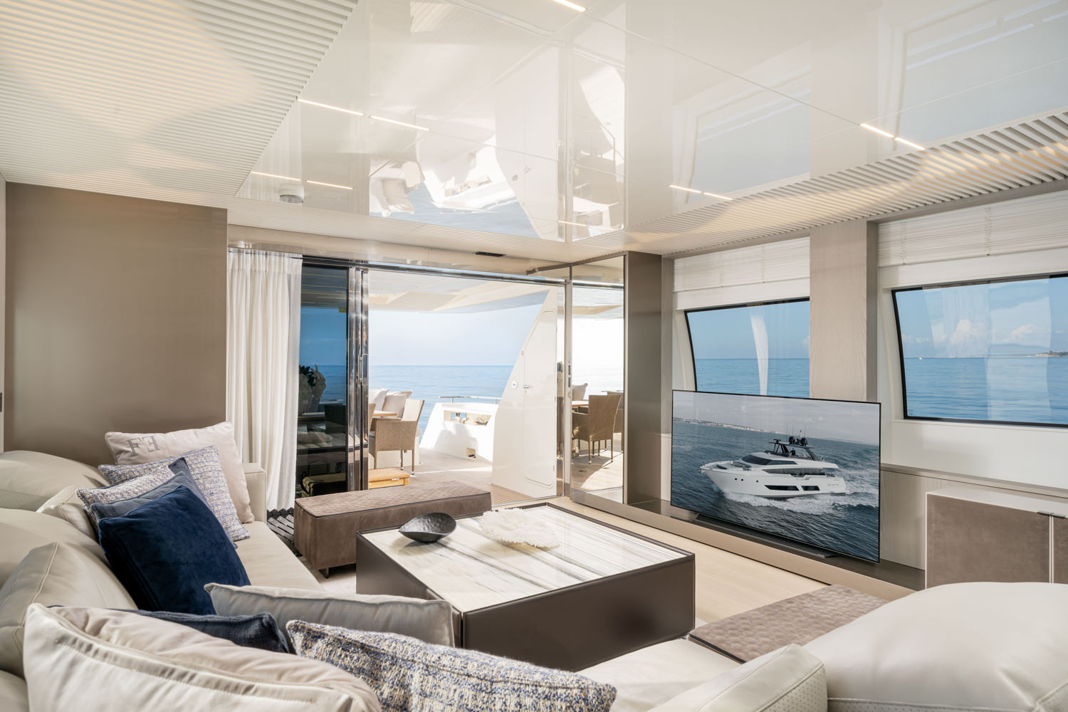 Spacious yacht main salon with contemporary design, photographed in Saint-Tropez.