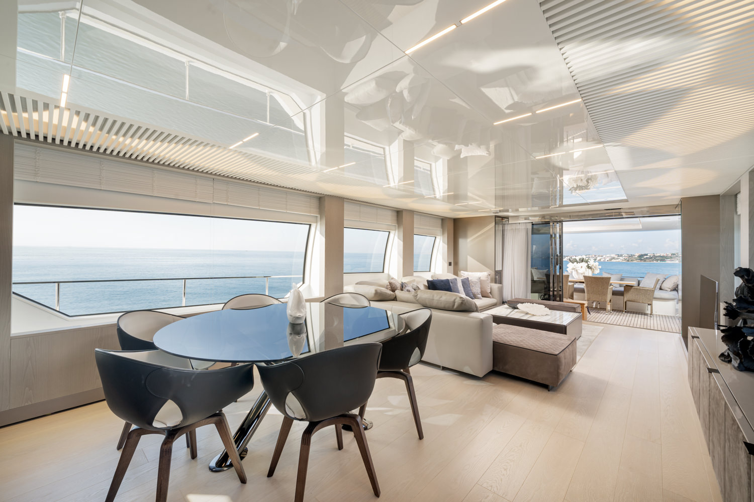 Main salon of a Ferretti yacht with elegant design, photographed in Genoa.