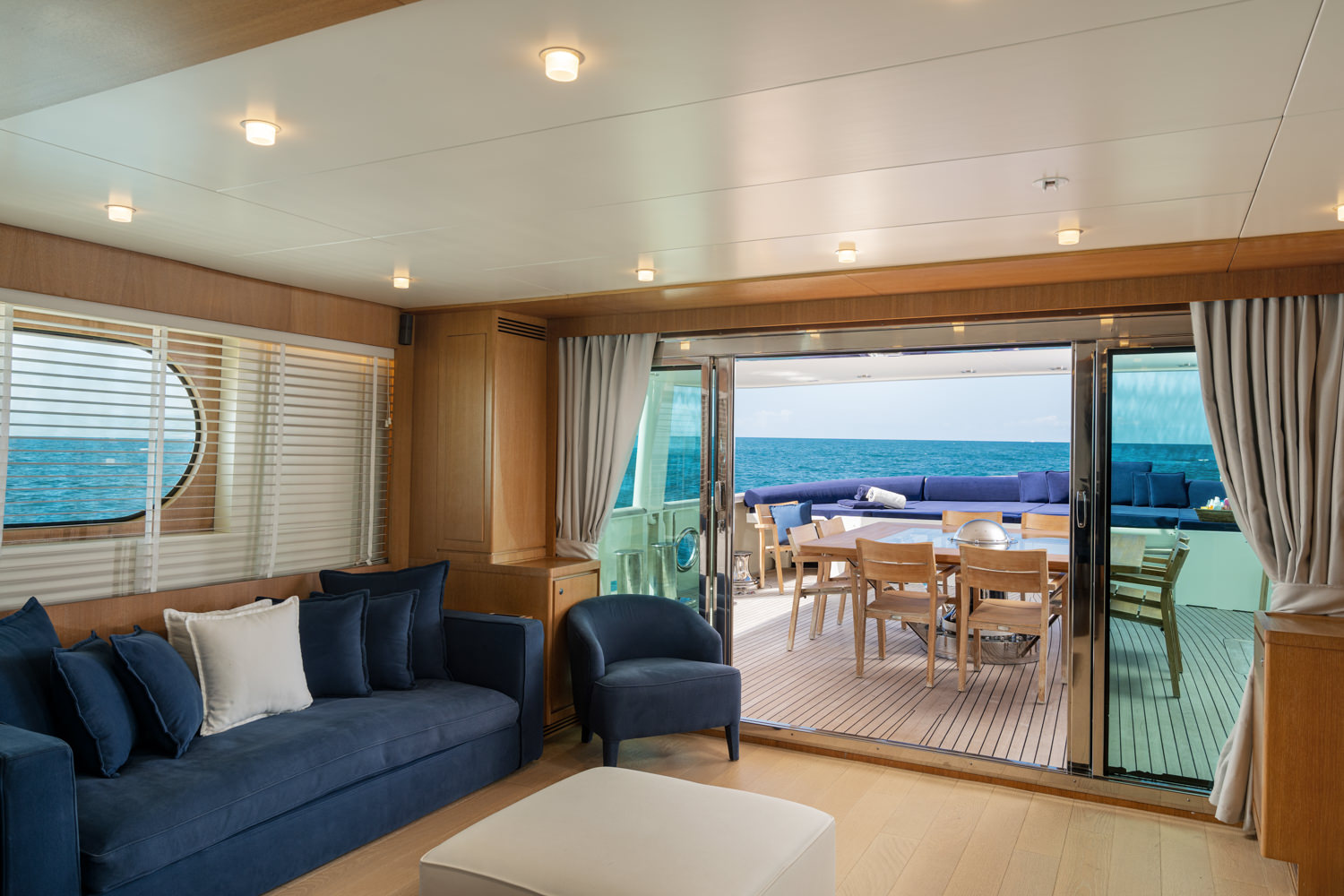 Elegant main salon aboard a luxury yacht, photographed in Naples.