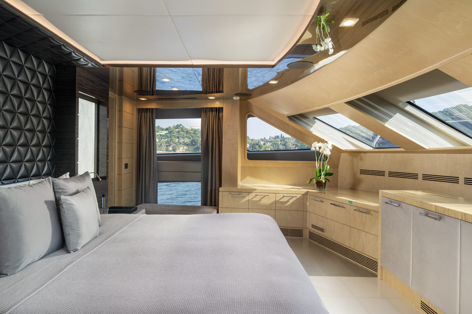 Luxury Benetti yacht master room with elegant design, photographed in Monaco.