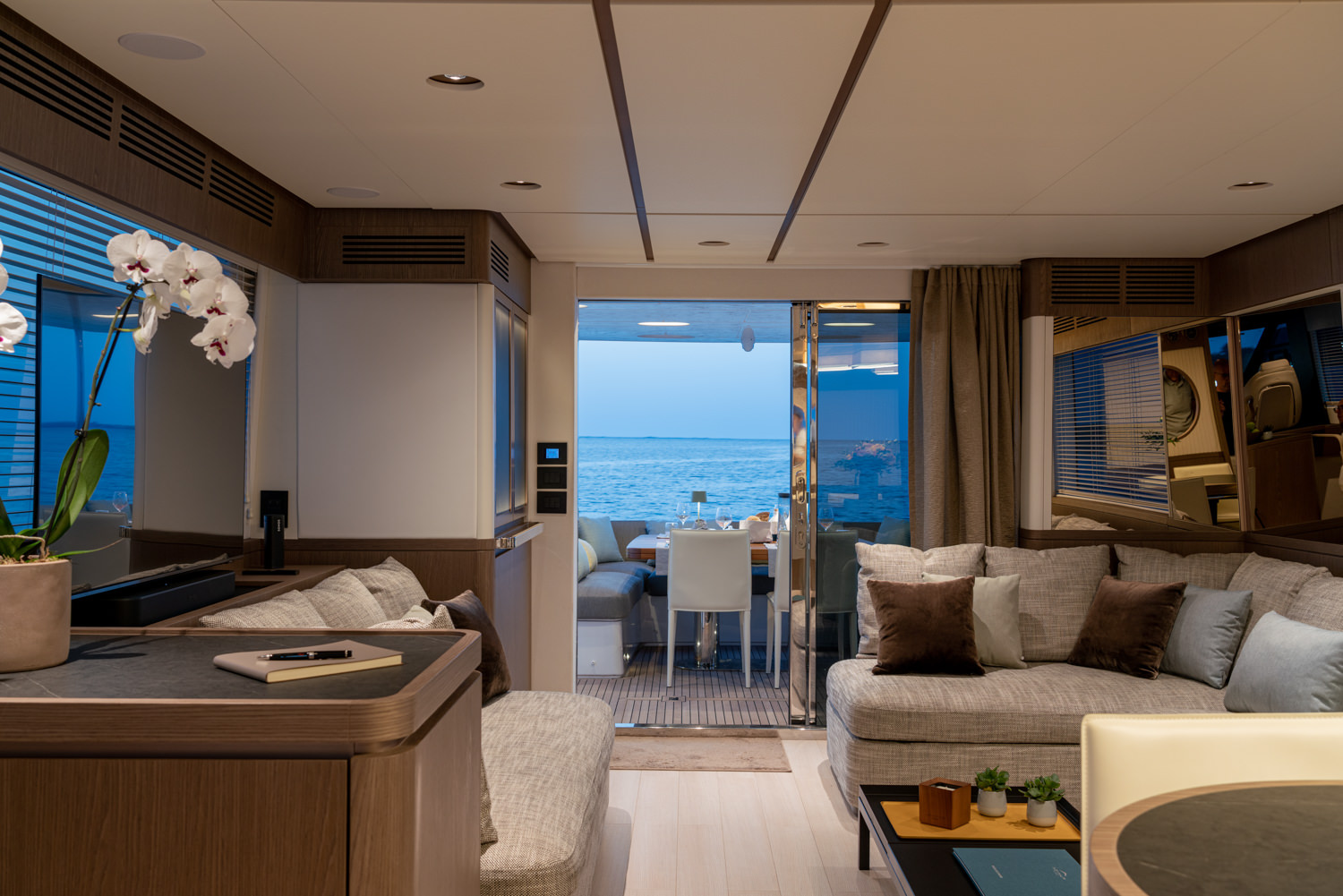 Main saloon of a luxury yacht with elegant furnishings, photographed in Ventimiglia.