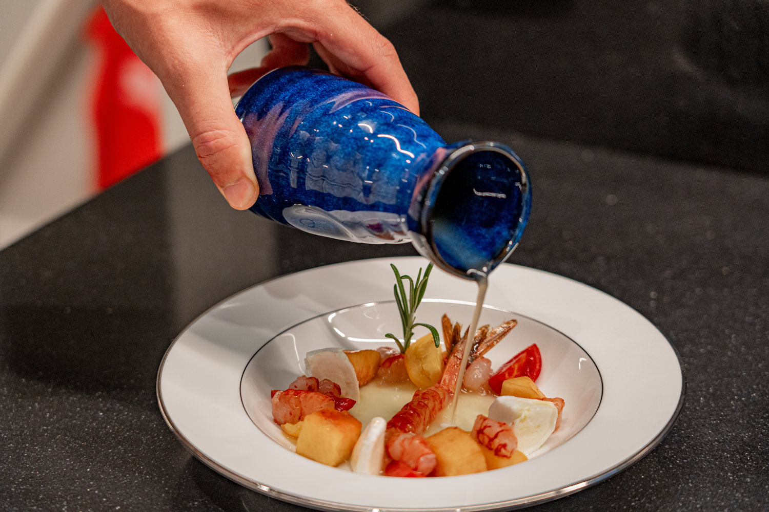 Gourmet meal served on a luxury yacht, photographed in Saint-Tropez.