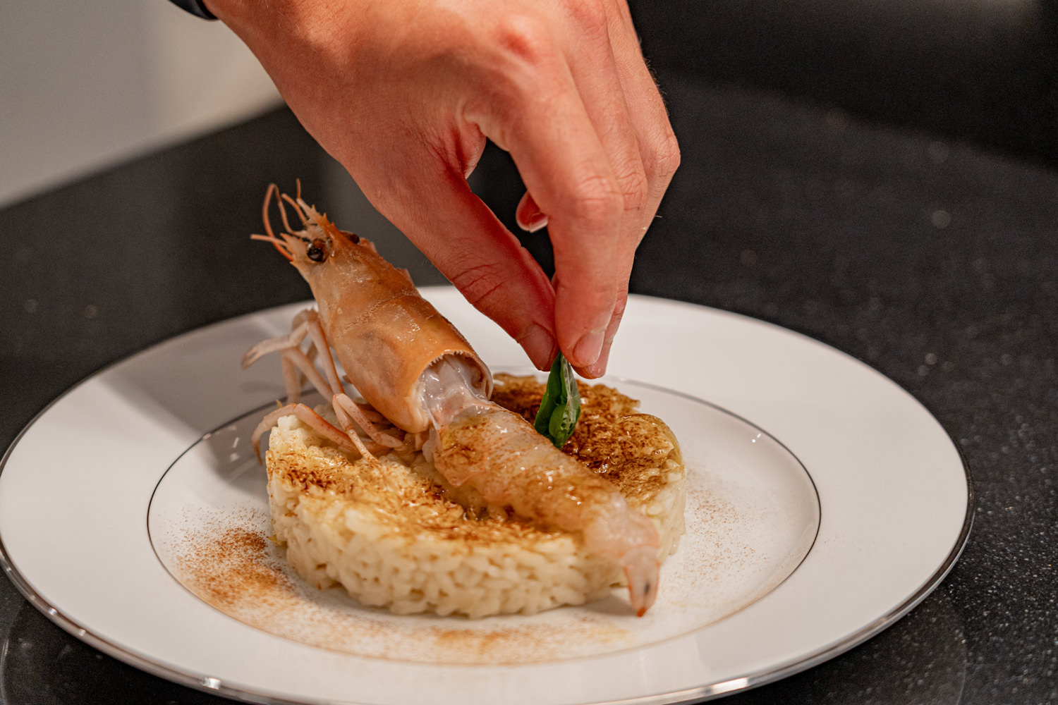 Elegant gourmet dish served on a luxury yacht, photographed in Monaco.