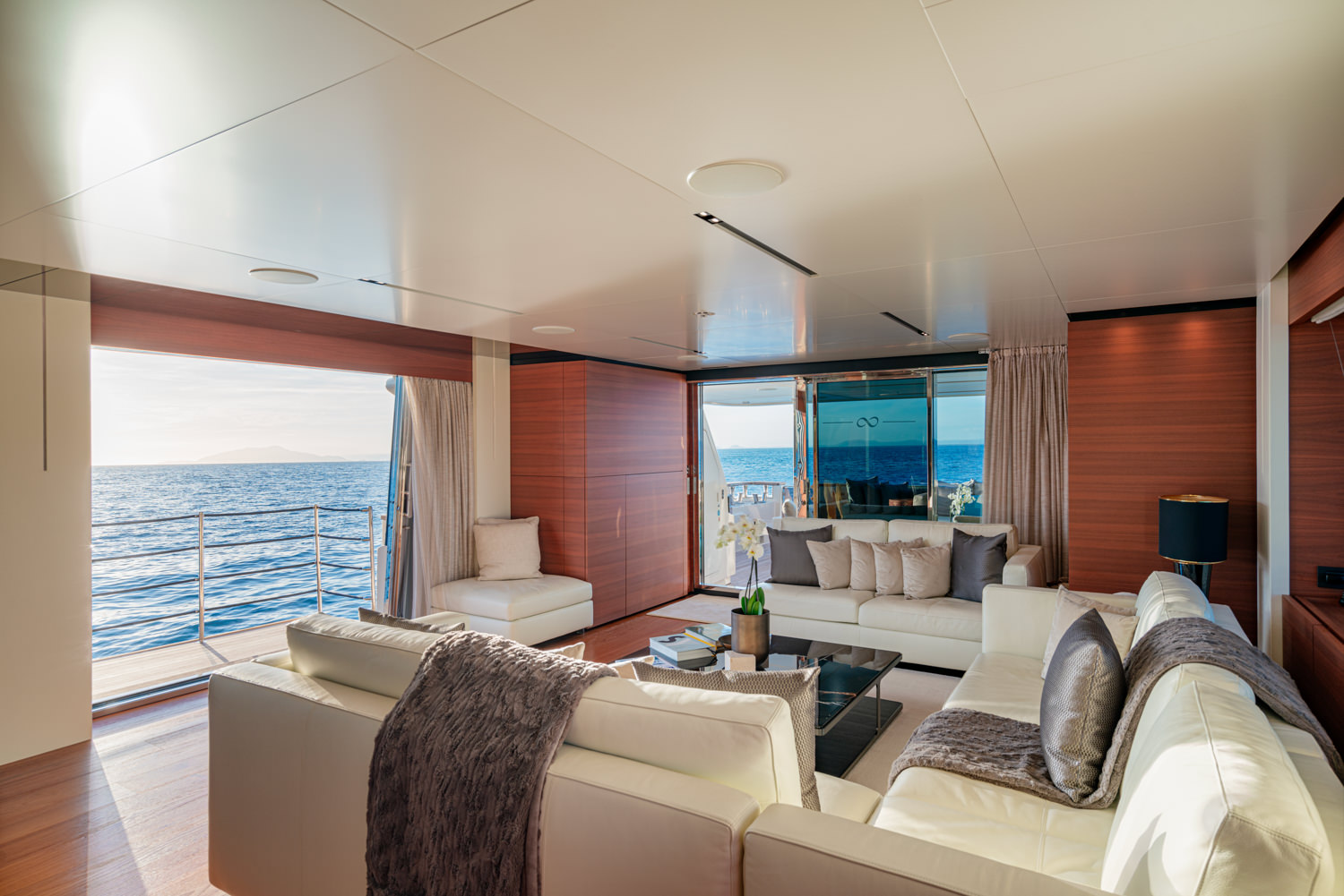 Elegant main salon aboard a Ferretti yacht, photographed in Cannes.