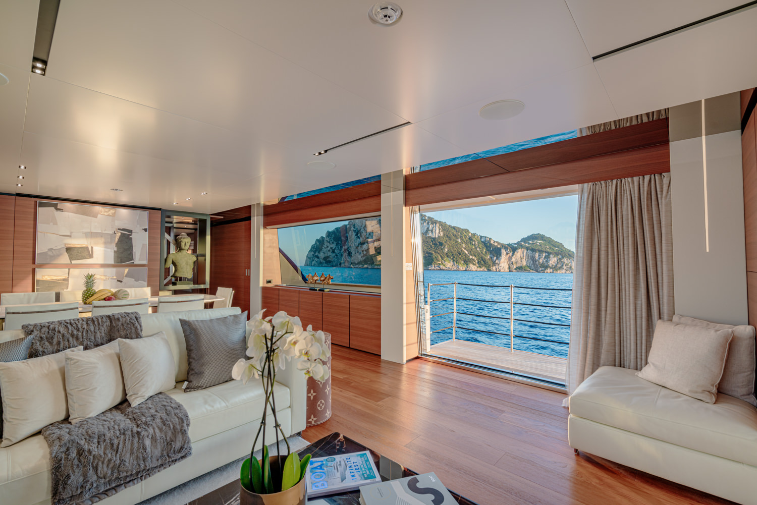 Spacious and luxurious main salon aboard a Ferretti yacht, photographed in Saint-Tropez.
