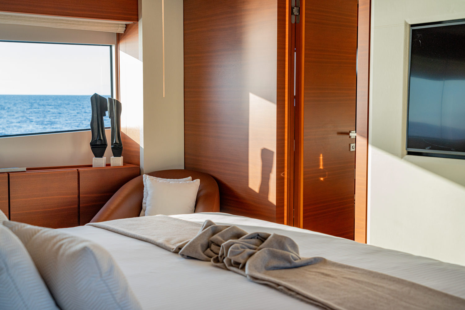 Luxurious master cabin aboard a Ferretti yacht, photographed in Portofino.