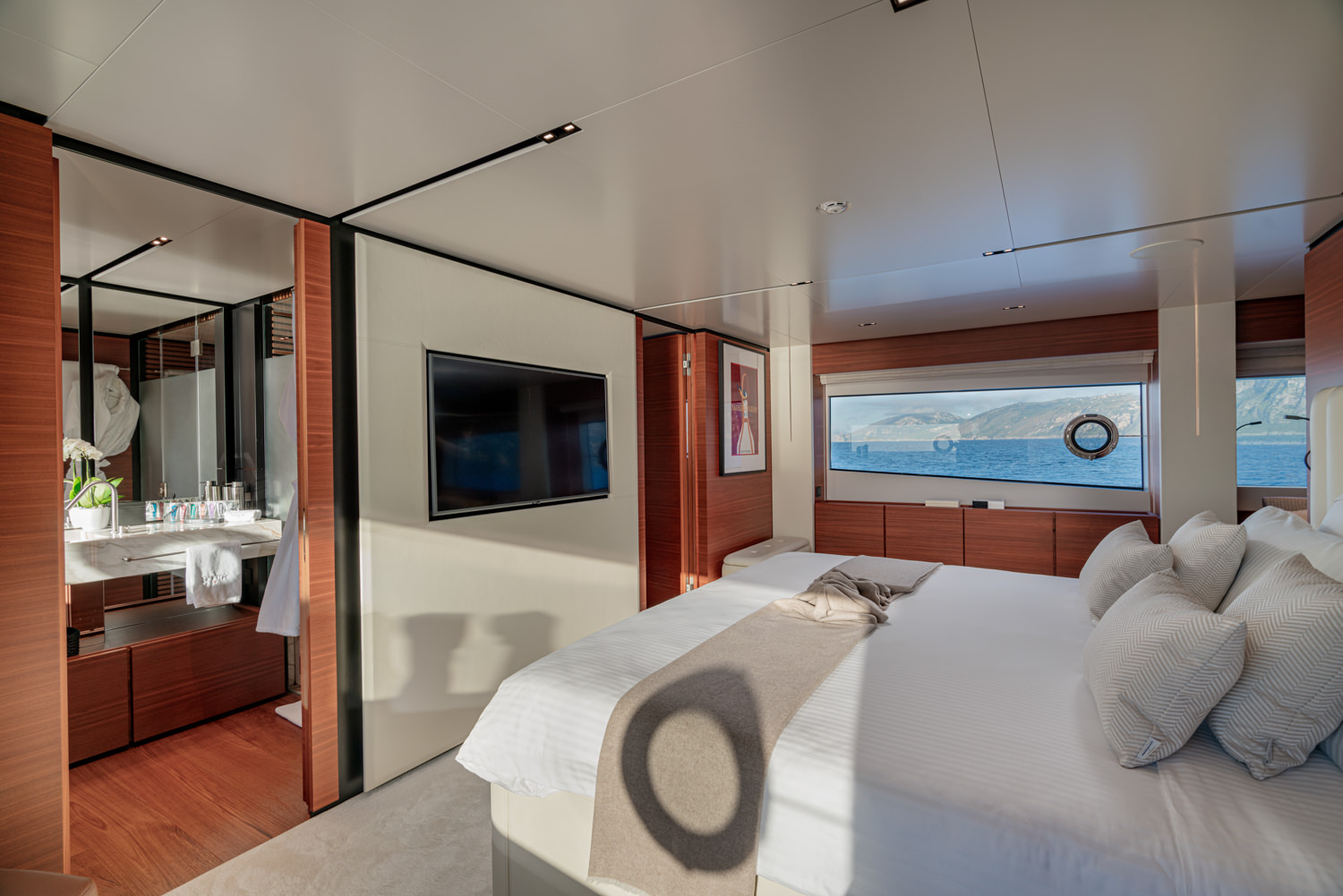 Stunning master cabin aboard a Ferretti yacht, photographed in Cannes.