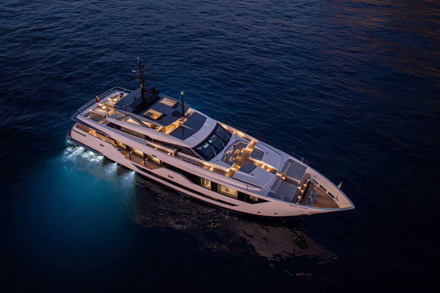 Drone-captured aerial view of a luxury yacht near Loano, highlighting its elegant features.
