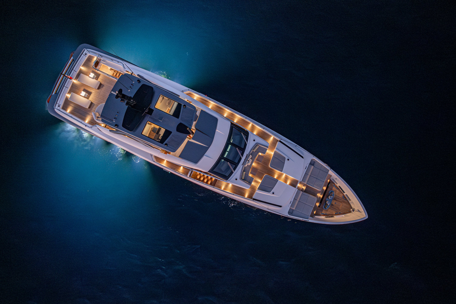Aerial photo of a luxury yacht navigating near Genoa, featuring its modern design.
