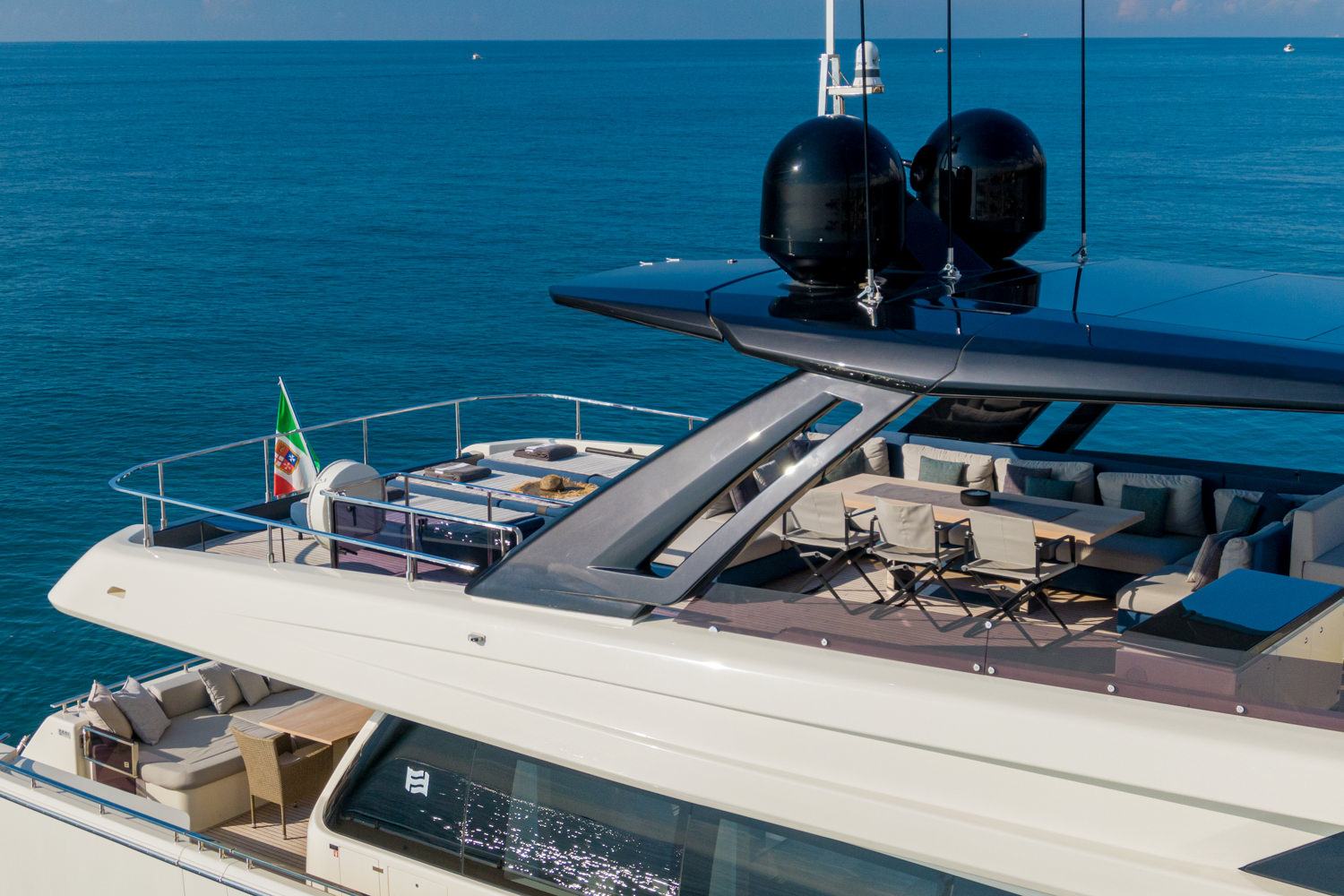 Aerial shot of a luxury yacht anchored near Nice, captured by a drone photographer.