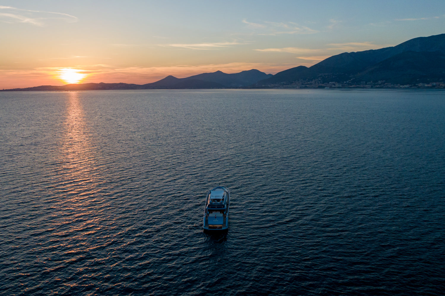 Aerial view of a luxury yacht sailing near Cannes, captured by a professional drone photographer.